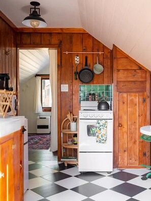 kitchen w/ sink, microwave, oven, kitchenette,  marble table & Nespresso