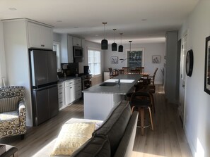 View of kitchen/siting/dining rooms taken  from the sitting room area.