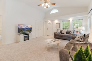 Large family room with a big screen Smart TV