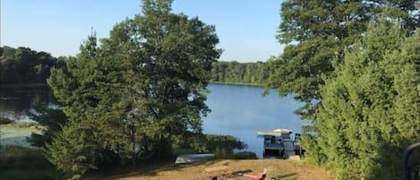 View of the lake from the large deck and  glass door in Kitchen/Living Room