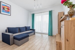 Living room with a comfortable sofa and TV. 