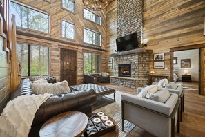 "Luxurious Rustic seating awaits in our cabin's heart, where comfort meets serenity."