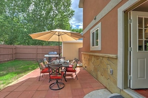 Private backyard and patio with dining and grill