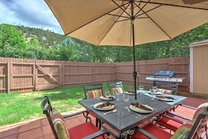Fenced backyard with patio dining