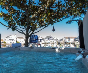 Waterfront serenity meets hot tub bliss—your private escape under the trees