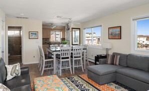 Spacious, stylish, and sun-fill -gather here for meal, games, & waterfront view