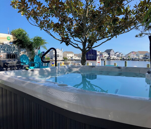 Soak in the view—your private hot tub retreat just steps from the lagoon 🌿🛁☀️”