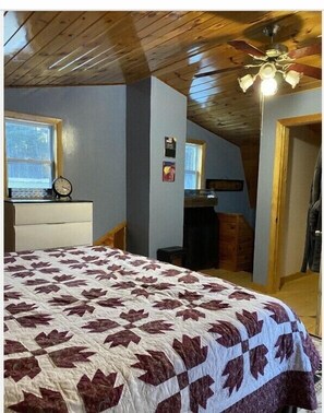 Master bedroom w king size bed, half bath, walk in closet and balcony 