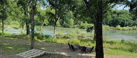 Step straight into nature—relax riverside with a private fire pit and direct access to the Glover River.