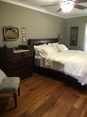 Master Bedroom with king bed is spacious, large wall TV and attached bathroom
