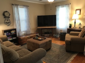 The living room is casual and comfortable, with plenty of seating.  