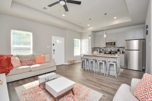 Living area & kitchen w/ seating for 4 (highchair available if needed for kids)
