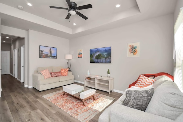 Sofa & love seat , 65in TV with Netflix, Apple TV, Disney, Hulu & YouTube