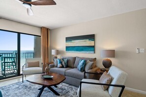Living Room - The beach front living room offers superb views! The comfy sofa is a sleeper.