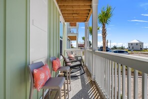 Enjoy the coastal breezes from the front porch of Cast Your Cares