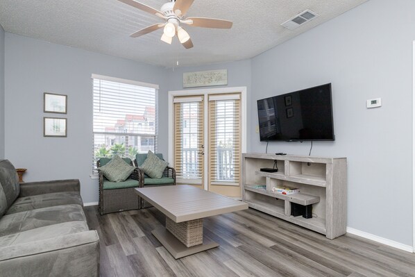 Great living space with private balcony and flat screen TV to enjoy