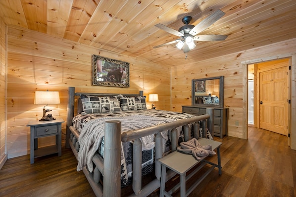 Main bedroom first floor of the cabin with king-size bed and ensuite bathroom.