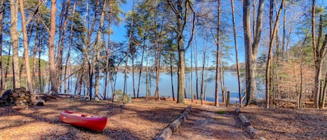 View of the lake from ground level at the back of the home. 