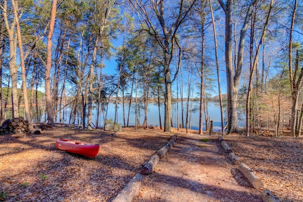 View of the lake from ground level at the back of the home. 