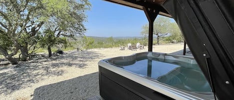 The Texas Longhorn Cabin sleeps up to nine...and it just so happens that many people can also fit comfortably into the great big hot tub!