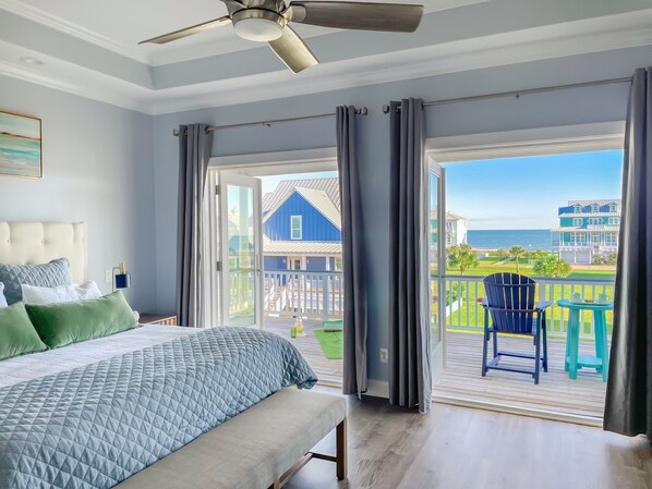Gorgeous ocean view from the luxurious master suite, with king bed, en-suite bath, private balcony, coffee bar, streaming TV, and a cute nook with daybed and trundle.