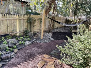 Restful shady spot with hammock in rear garden!