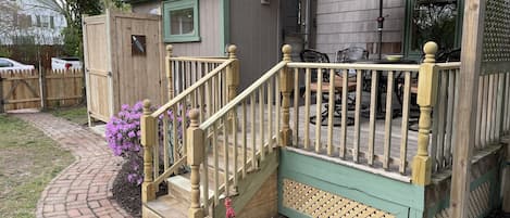 Deck overlooking rear garden with outside shower for return from the beach!