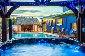 View of the tiki bar and the pool from the hot tub.