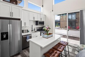 Fully stocked kitchen with both a drip pot coffee maker and keurig.