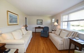 Living area with comfortable seating for seven. 