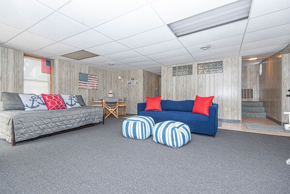 ground floor family room and stairway to upper main floor 