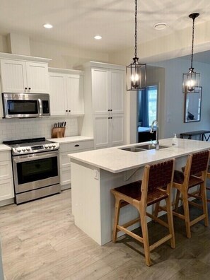 Gorgeous new kitchen with stainless steel appliances and quartz counter tops