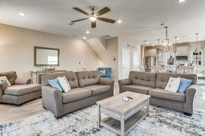 Living room is spacious and comfy, perfect for relaxing and enjoying family time