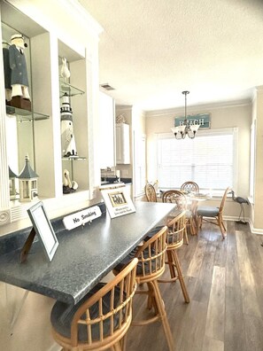 Kitchen, bar area with additional seating