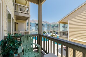 Private balcony off the living area with beautiful pool views