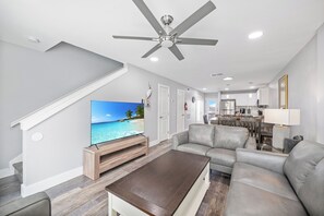 Inviting layout with seamlessly integrated kitchen, dining, and living areas, perfect for creating lasting memories