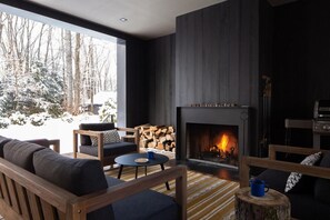 Large covered porch, fire place, Weber grill, dining area