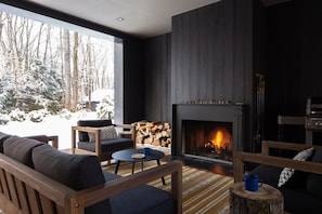 Large covered porch, fire place, Weber grill, dining area