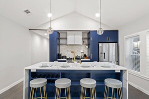 Large custom kitchen with waterfall island