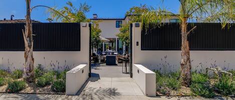 Main entrance to house through courtyard/ patio