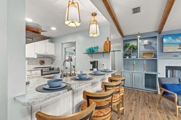 The breakfast bar, with seating for four, is easily accessible from the living room.