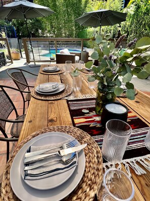 Gorgeous outdoor table with shade sail to create the perfect ambiance. 