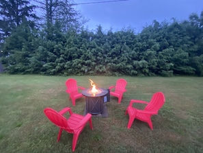 Gas firepit with adirondack chairs 