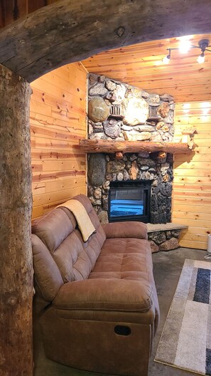 Large couch and fireplace 