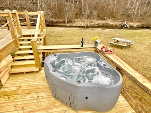 hot tub set up privately by the creek