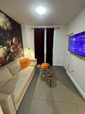 Living Room with a pull-out couch and Smart TV with access to streaming services