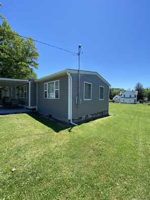 Trucks and Trailers may be parked in the grass along this side of the house