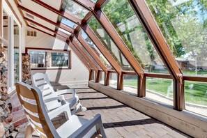Relax and enjoy the beautiful sunroom.