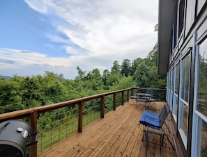 Enjoy the spacious deck with charcoal grill and beautiful mountain views