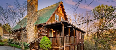 Nestled within the majestic Smokey Mountain forest, the homey cabin awaits your arrival. 